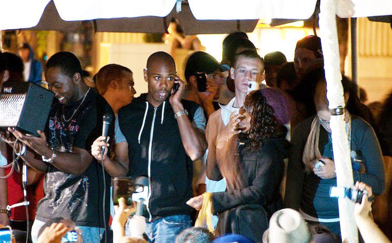 Dave Chappelle (center, shown in 2009) returns to Houston March 22 and 23 at Revention Music Center.