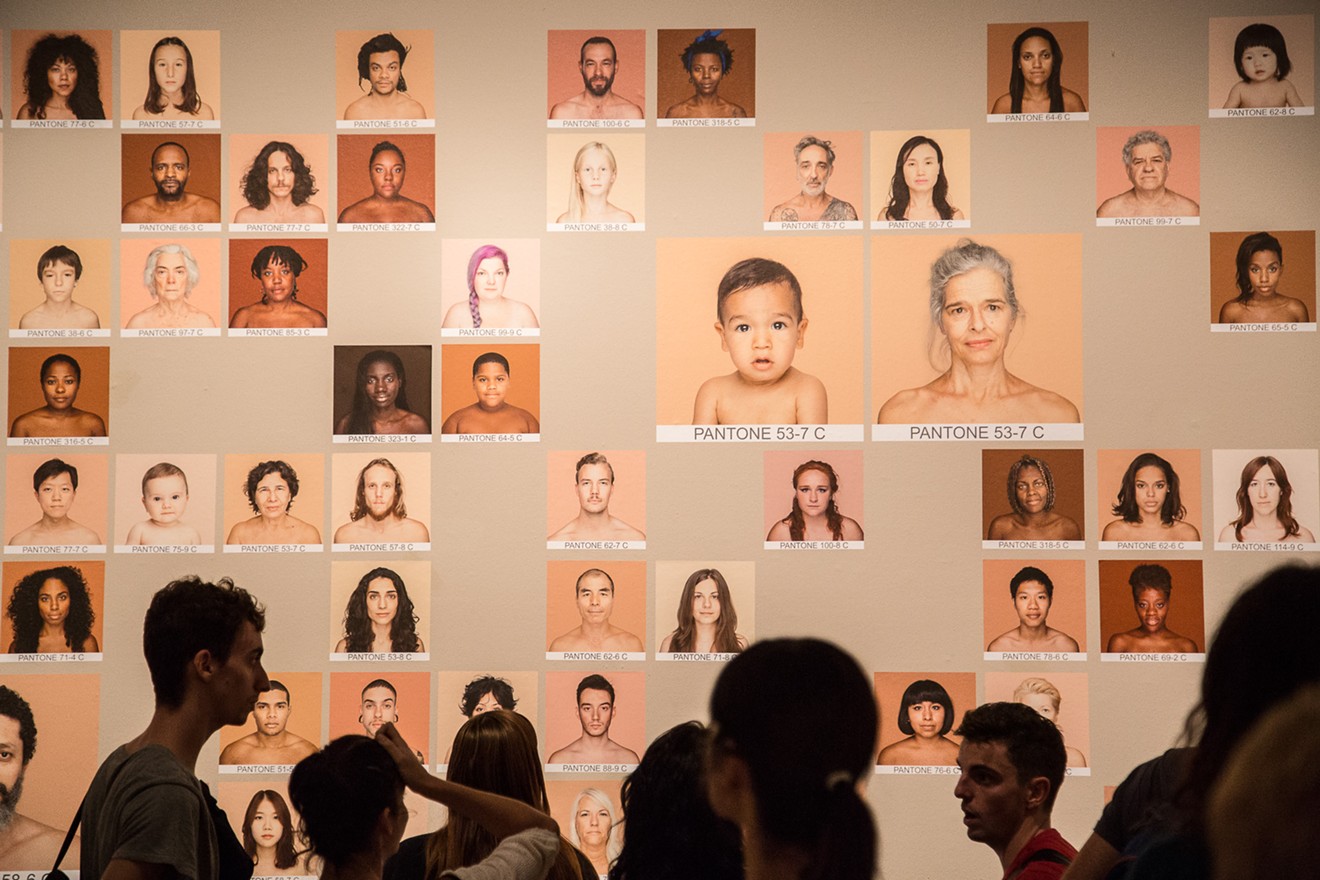 Brazilian artist Angelica Dass assigns Pantone swatch colors to 250 people from around the world in "HUMANAE: Work in Progress" at The Health Museum.