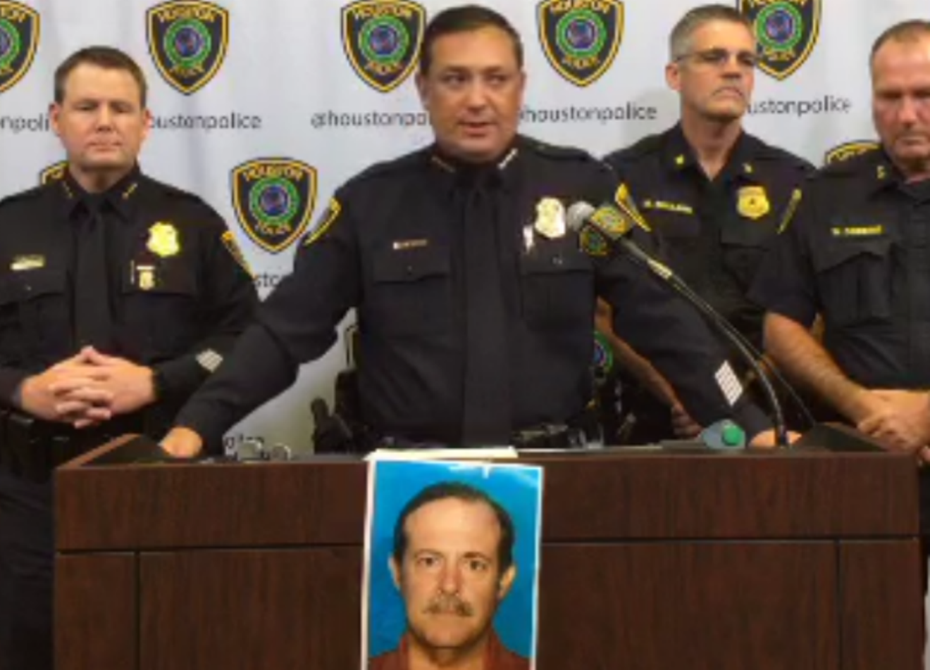 Chief Art Acevedo, center, standing above a photo of suspect in the case, Joseph James Pappas.