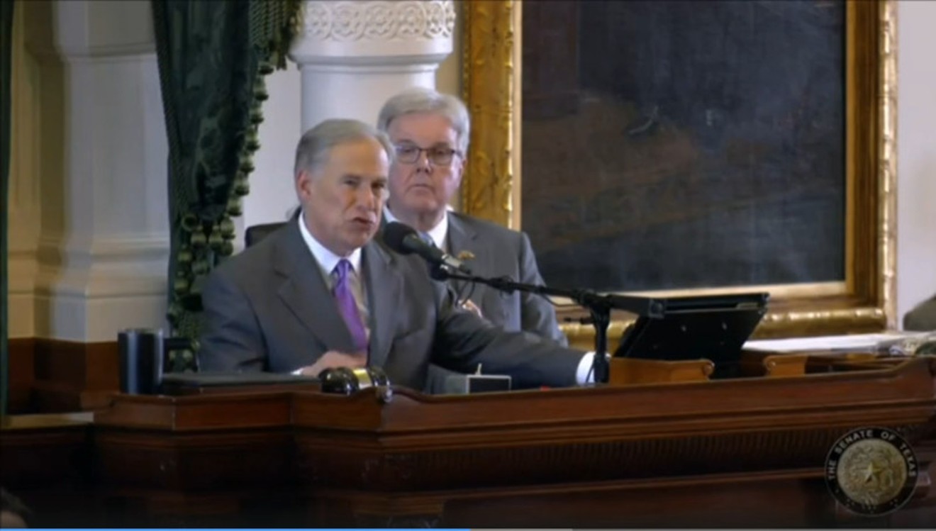 Gov. Greg Abbott speaks to the Senate Tuesday while Lt. Gov. Dan Patrick listens in.