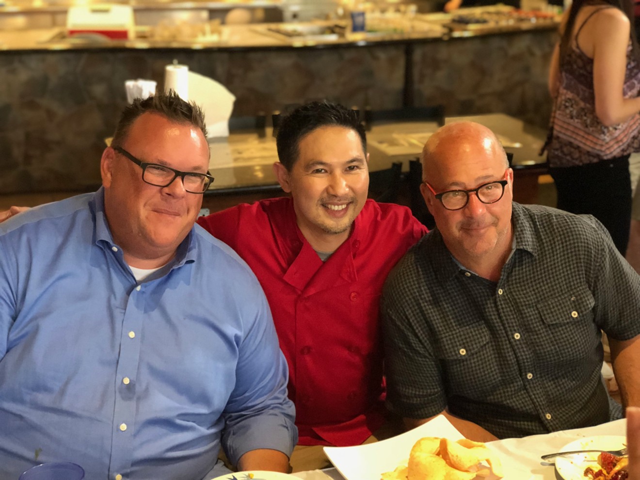 Andrew Zimmern with Chris Shepherd (left) and Trong Nguyen (center) at Crawfish & Noodles in Asiatown. Zimmern was in town for a taping of his show, The Zimmern List.