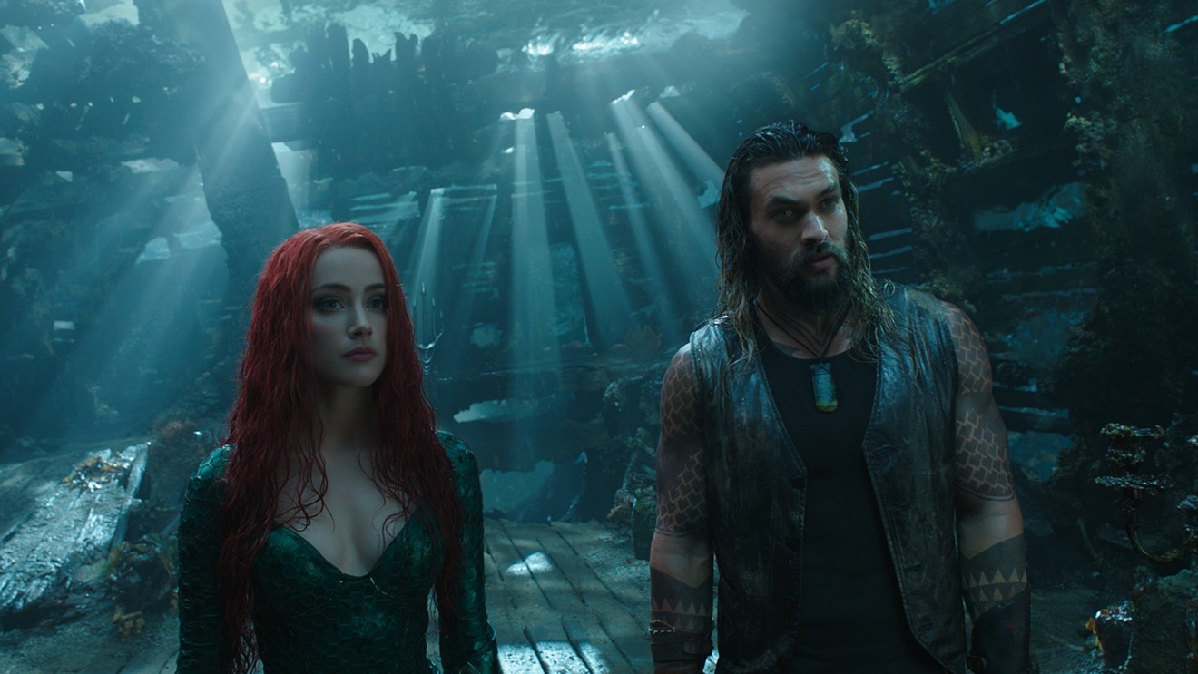 Jason Momoa (right) plays Aquaman, a hard-drinking surface-dweller townie raised in a Massachusetts lighthouse, and Amber Heard is Atlantean battle-mermaid Mera in James Wan’s superhero epic.