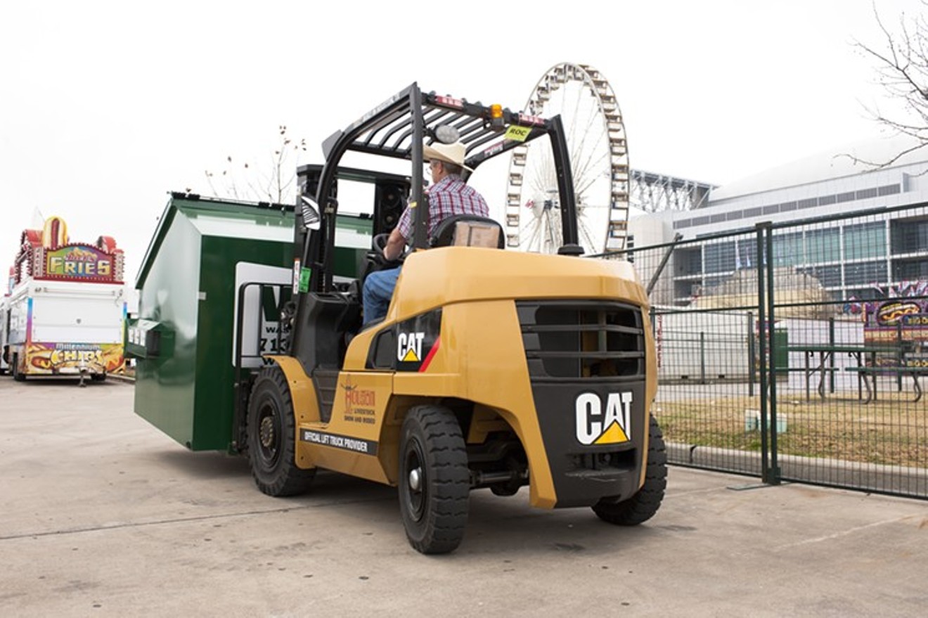 Cat Lift Truck provides services - pro bono - for the entirety of the Houston Rodeo. The money saved by this donation ends up as scholarships for future college students.