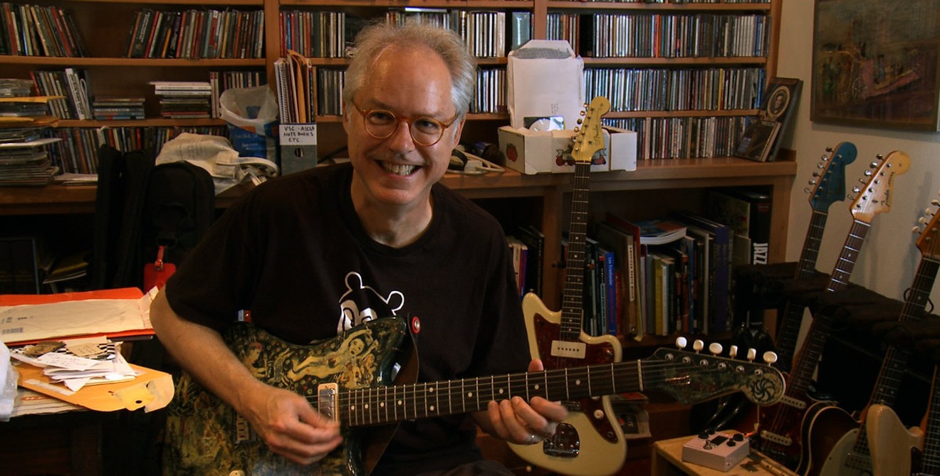 Bill Frisell in his music/record room at home with a favorite guitar.