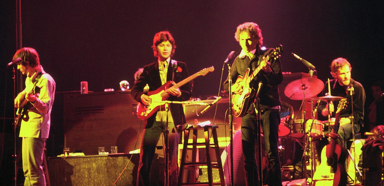 Bob Dylan, third from right, and The Band — L-R: Rick Danko, Robbie Robertson and Levon Helm — in Chicago, 1974