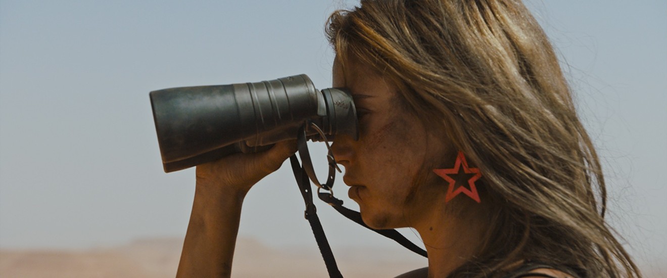 Matilda Lutz plays Jen, who after she is raped and left for dead, caked in blood, in a desert wasteland, vows to get what the title of Coralie Fargeat's film promises — Revenge.
