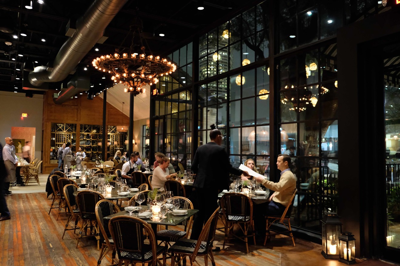 Emmaline's main dining room features floor-to-ceiling glass with views of the Houston skyline