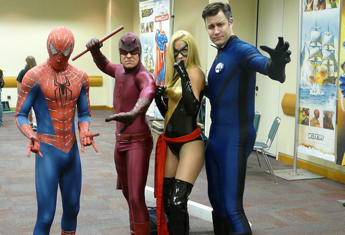As comic book fandom and conventions have gone mainstream, it's no surprise that Cosplayers - likes these Marvel fans in Indianapolis at GenCon - often come as Marvel and DC characters. But the rival companies have waged their own half-century battle for dominance.