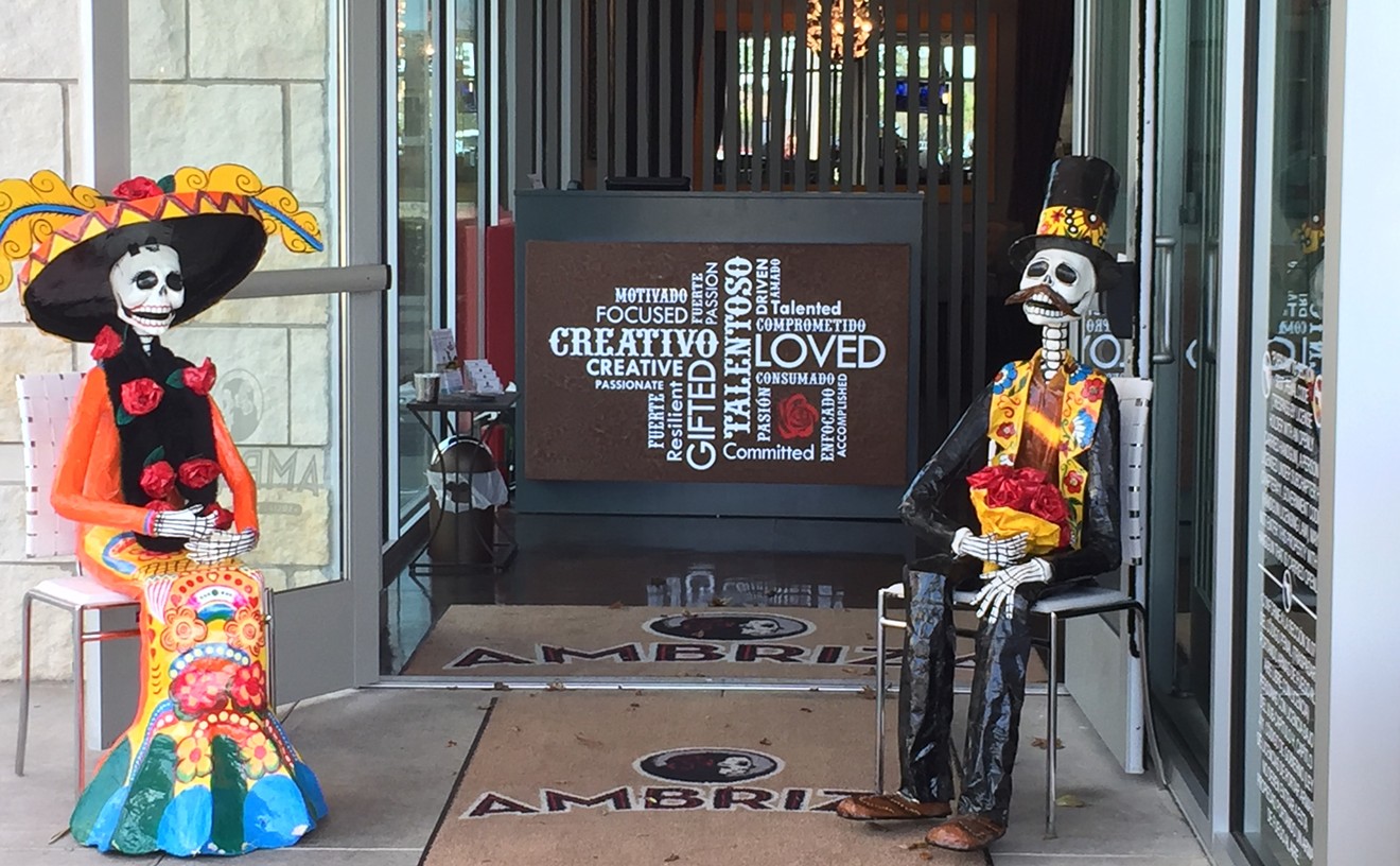 Whimsical calaveras welcome guests at the entrance to Ambriza.