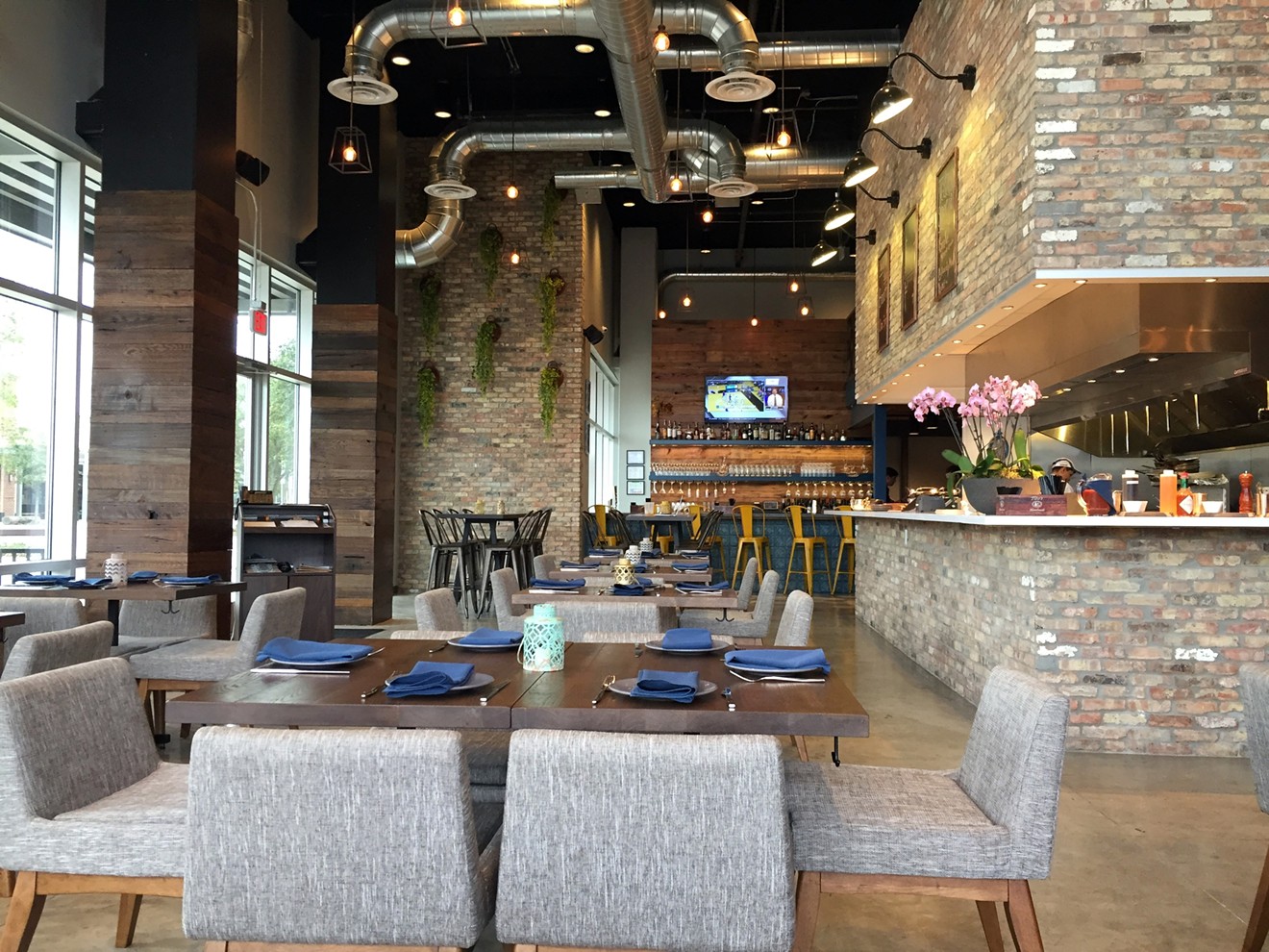 The decor of Broken Barrel is contemporary and features an open kitchen in the center of the restaurant.