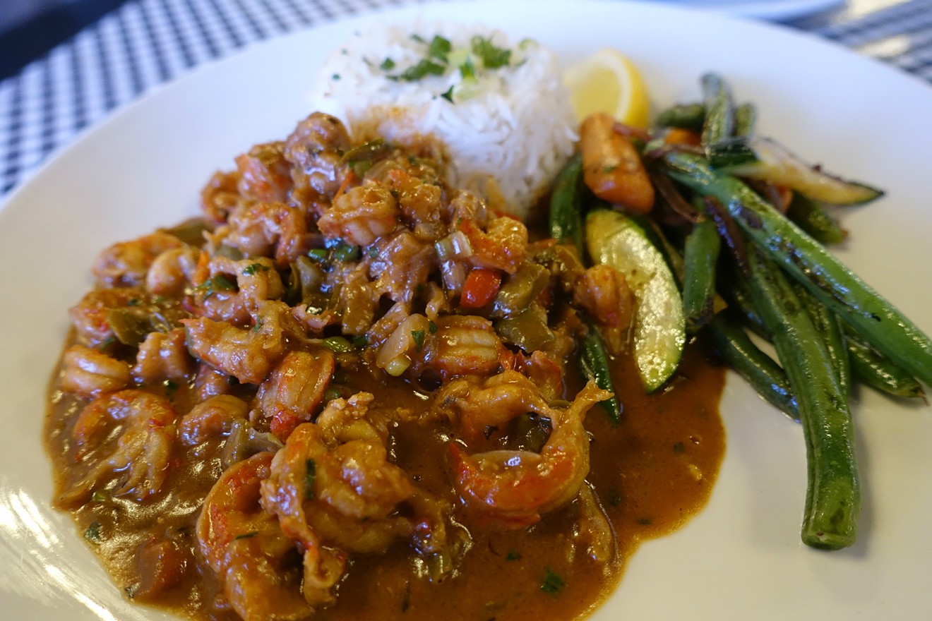 Rich crawfish étouffée with rice and seasoned vegetables will quickly be a favorite here.