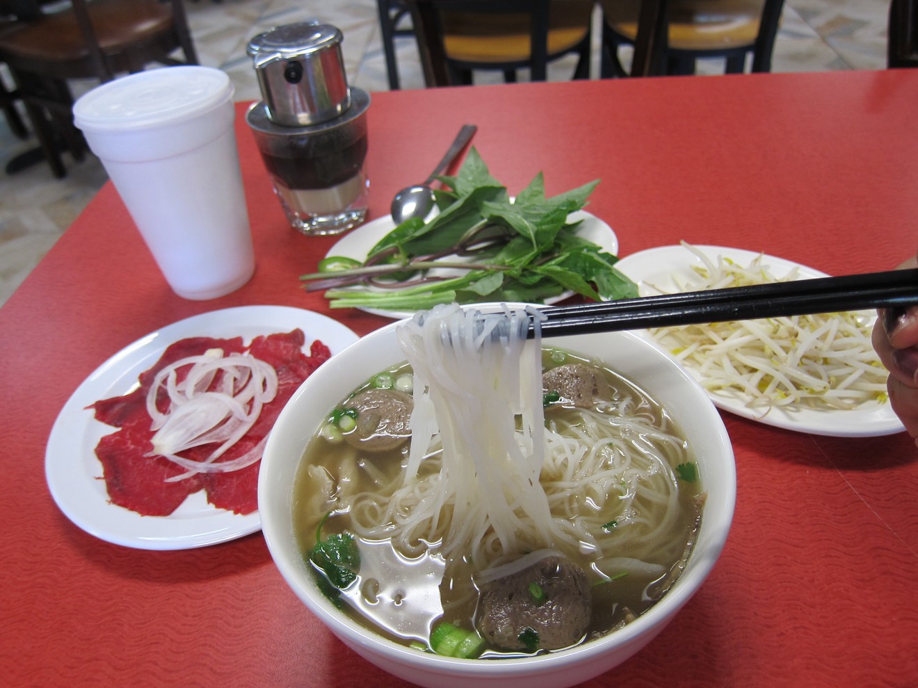 Small pho dac biet with tai on the side, and an order of cafe sua da at Pho Con Bo.