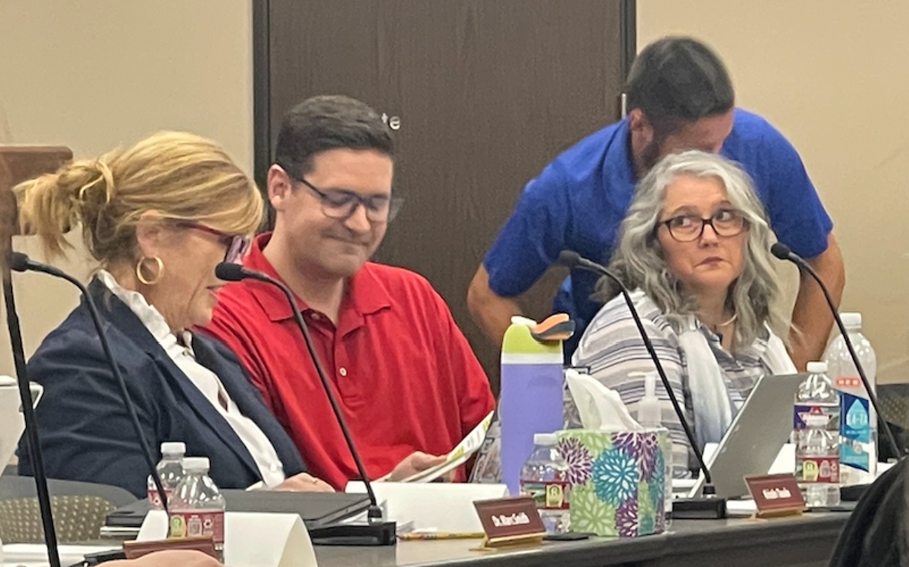 Newly elected board president Kristin Tassin, seated by trustees David Hamilton and Angie Hanan, moderated Wednesday's workshop.