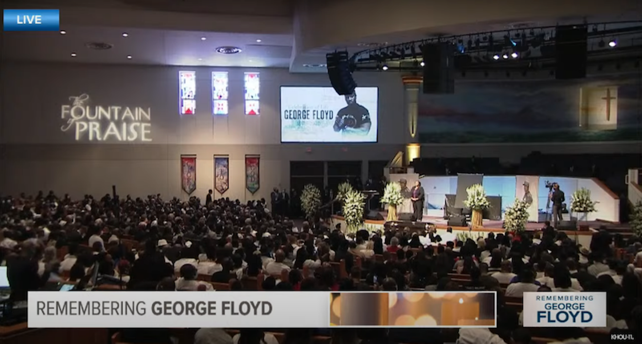 A packed crowd at The Fountain of Praise gathers to celebrate the life of George Floyd.