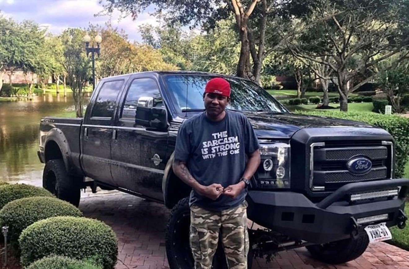 Victor Hoskins, the man who Ray Odom says deserves the props for their rescue efforts, standing in front of his Ford F-250, The Mule — which, Ray says, "suffered major damage due to countless high-water runs."
