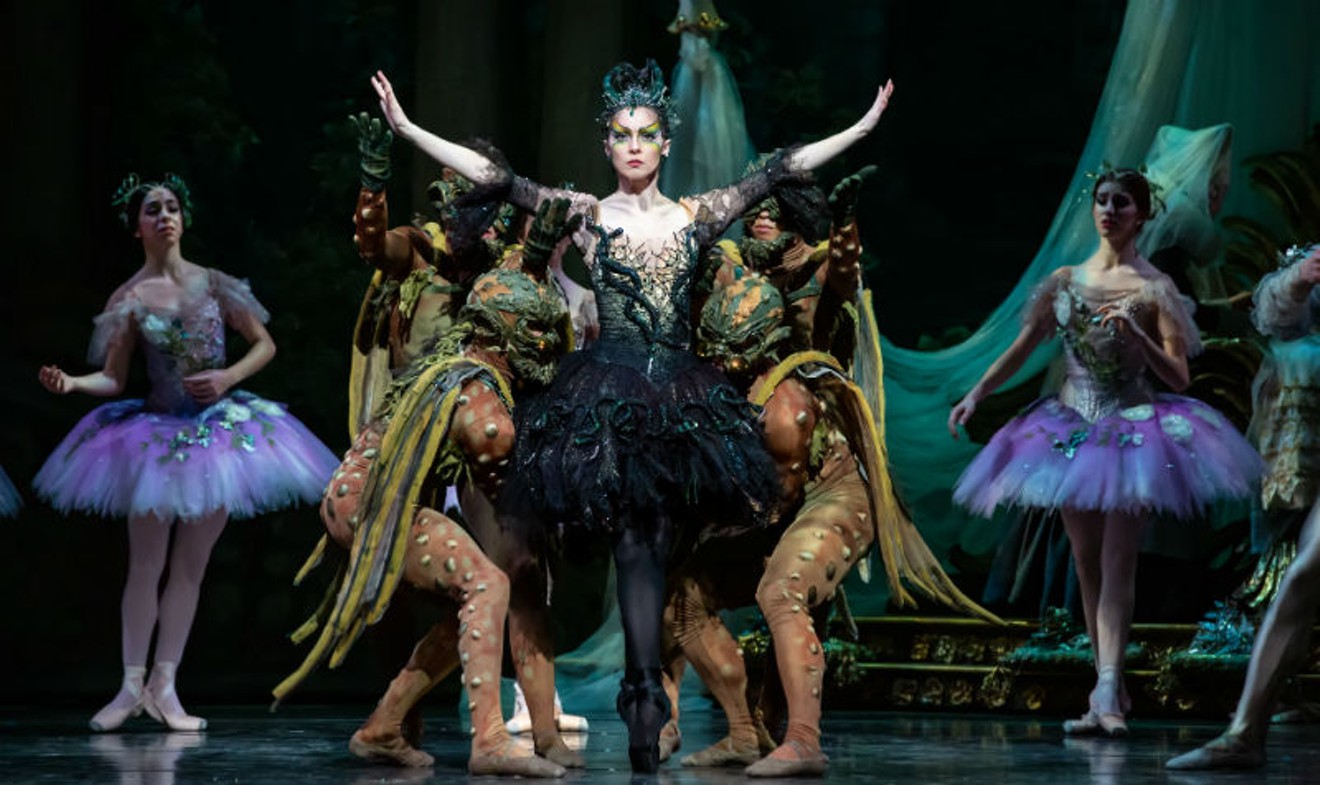 Houston Ballet Principal Melody Mennite as Carabosse with artists of Houston Ballet in Ben Stevenson's The Sleeping Beauty.