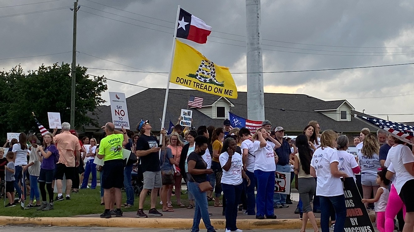 Unvaccinated Houston Methodist employees and their supporters protested the hospital's vaccine mandate Monday night.