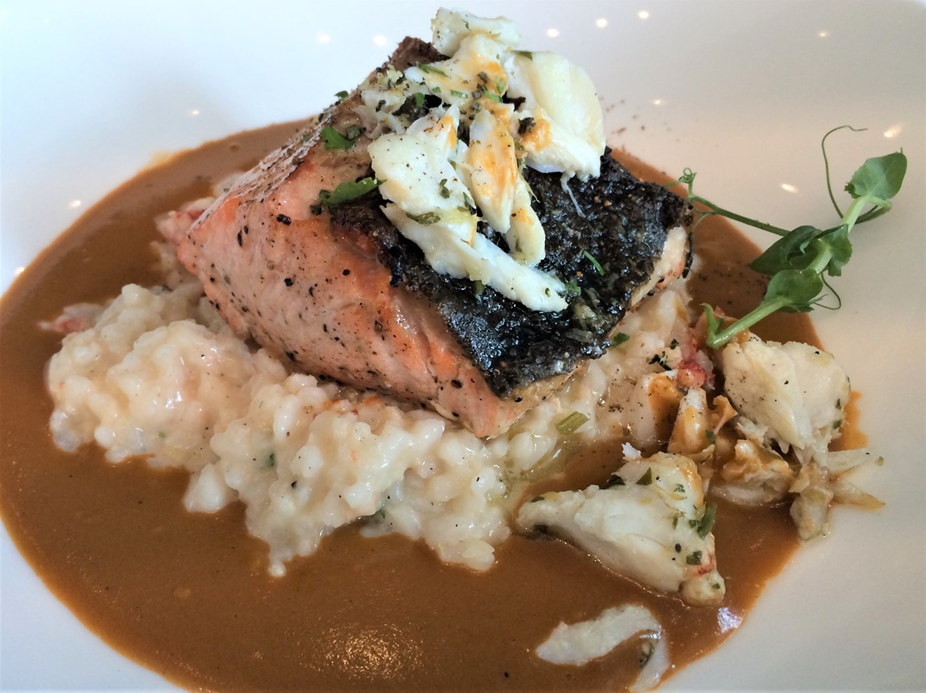 The salmon and risotto at Bistecca brings all the seafood to the bowl.