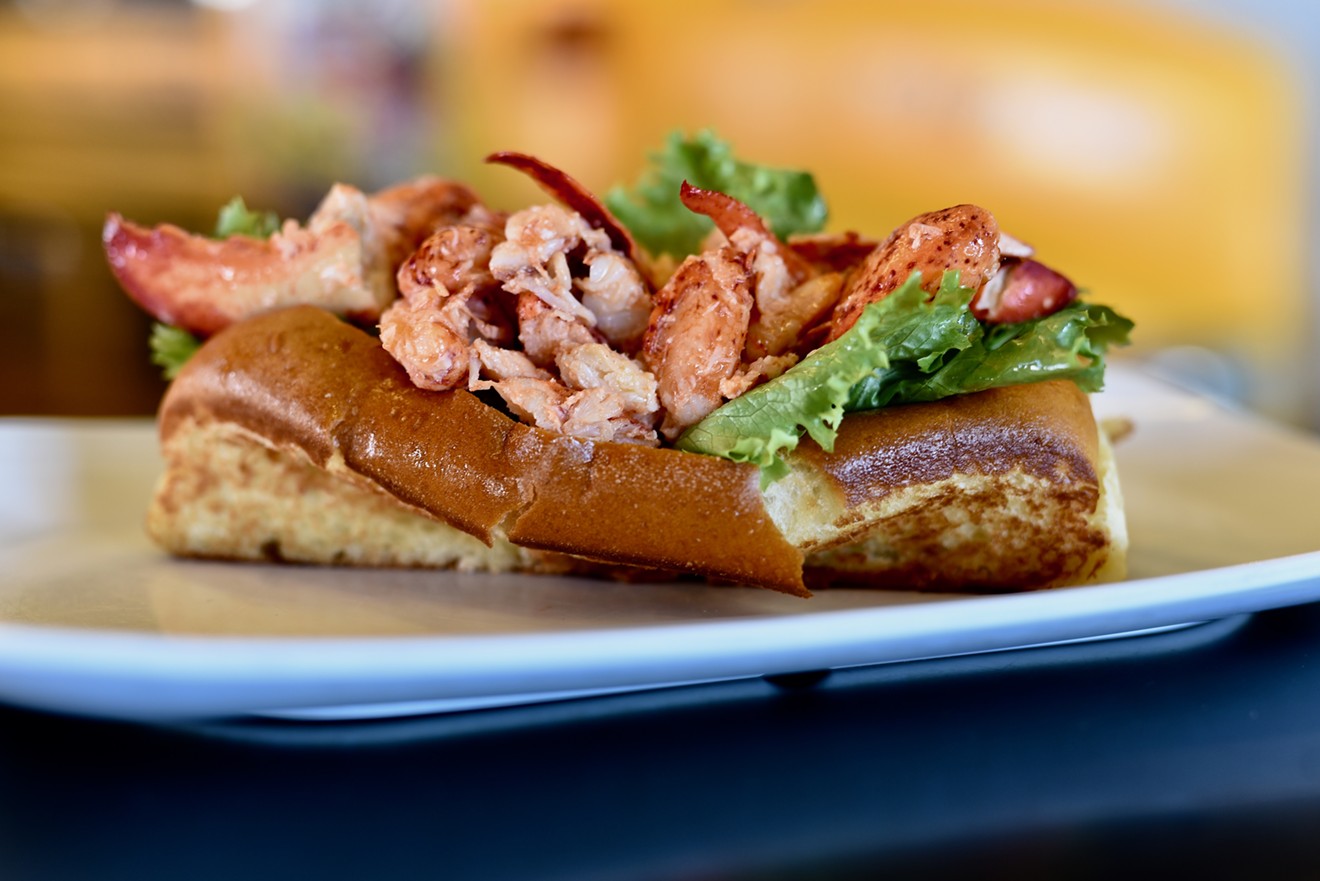 Bernie's Hot Lobster Roll features warm, butter-poached lobster, cradled in crisp lettuce and a top-loaded, butter-toasted bun.