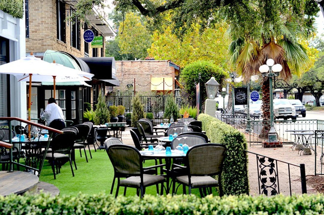 The lush outdoor dining area at Cafe Azur.