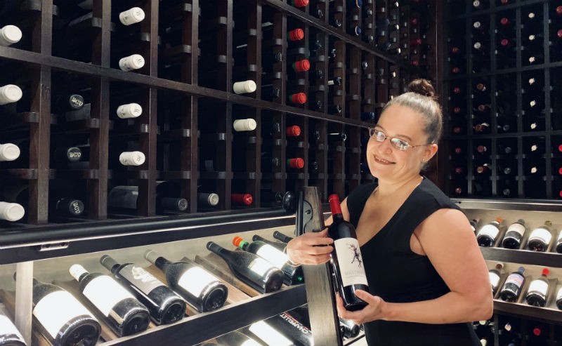 Vanessa Treviño Boyd in the wine cellar at TRIBUTE at the Houstonian Hotel.