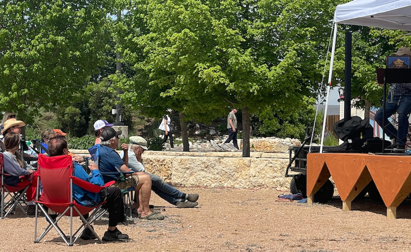 Visitors and residents attend a pre-eclipse event at The Cross At Kerrville, a sculpture prayer garden, that is a common tourist attraction.