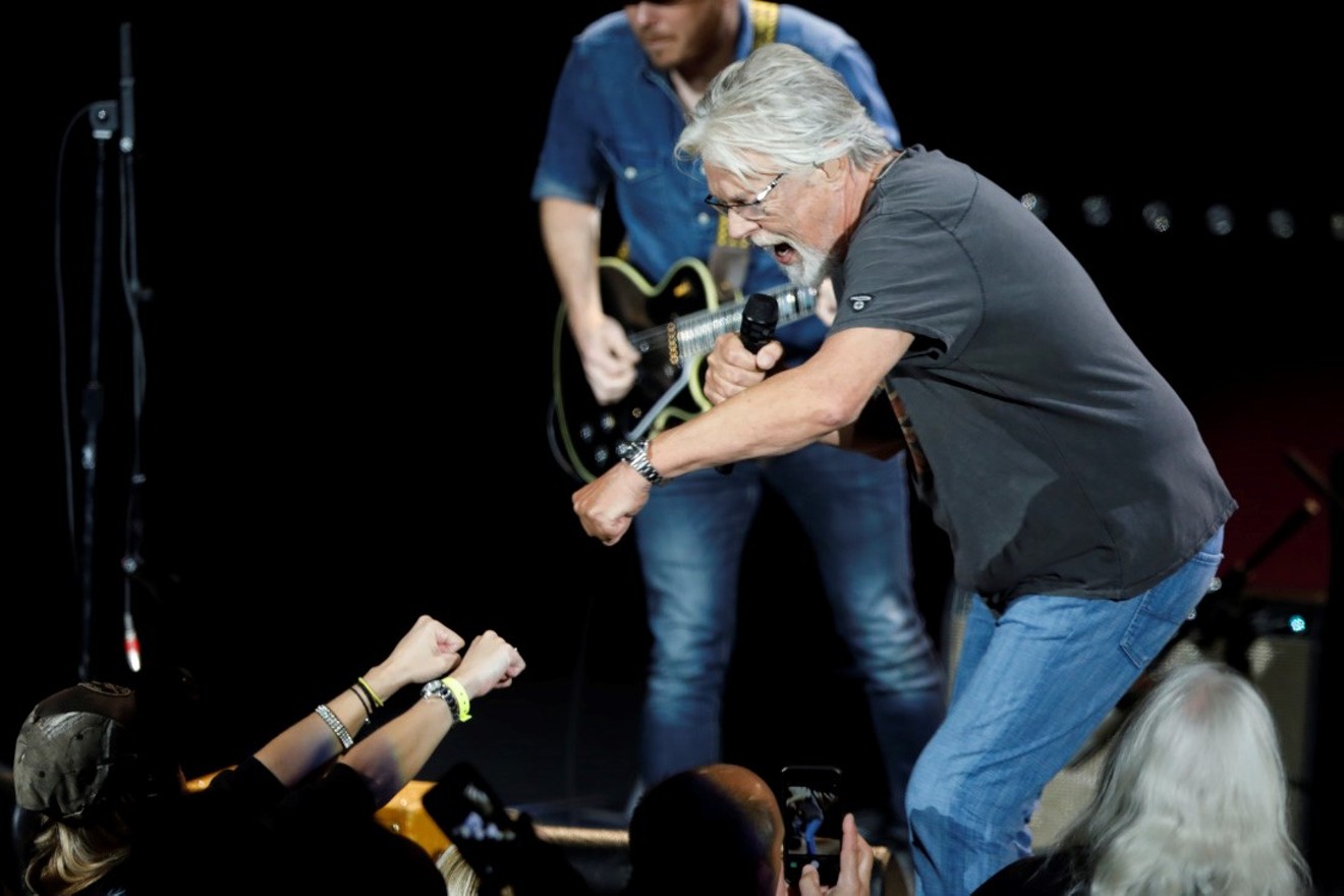 Bob Seger fist bumps the audience at a previous stop on his "Roll Me Away Farewell Tour."