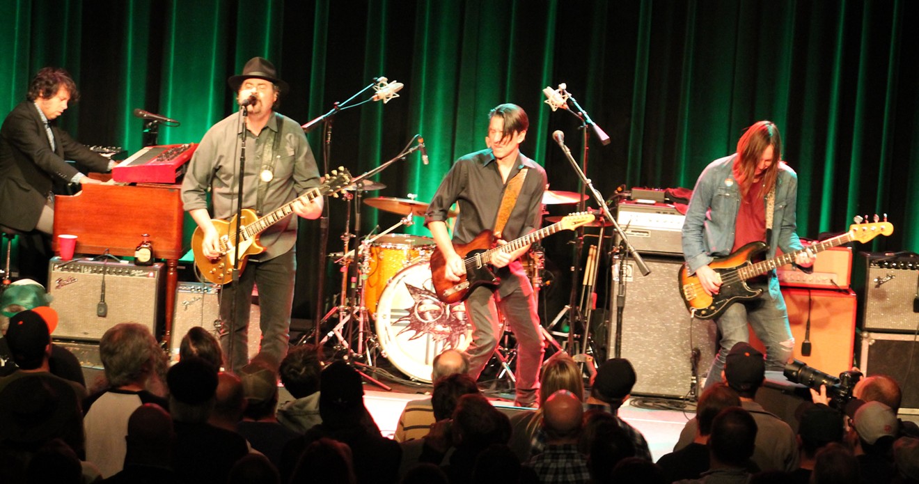 The Drive-By Truckers: Jay Gonzalez, Patterson Hood, Mike Cooley, and Matt Patton. Brad Morgan is hidden behind Cooley.