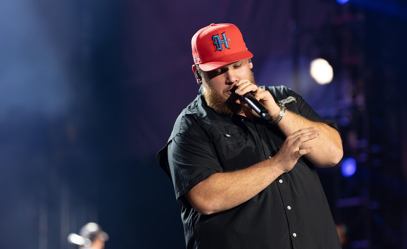 Luke Combs wore one of the new "Battle Red" Houston Texans fitted hats during his performance in Houston.