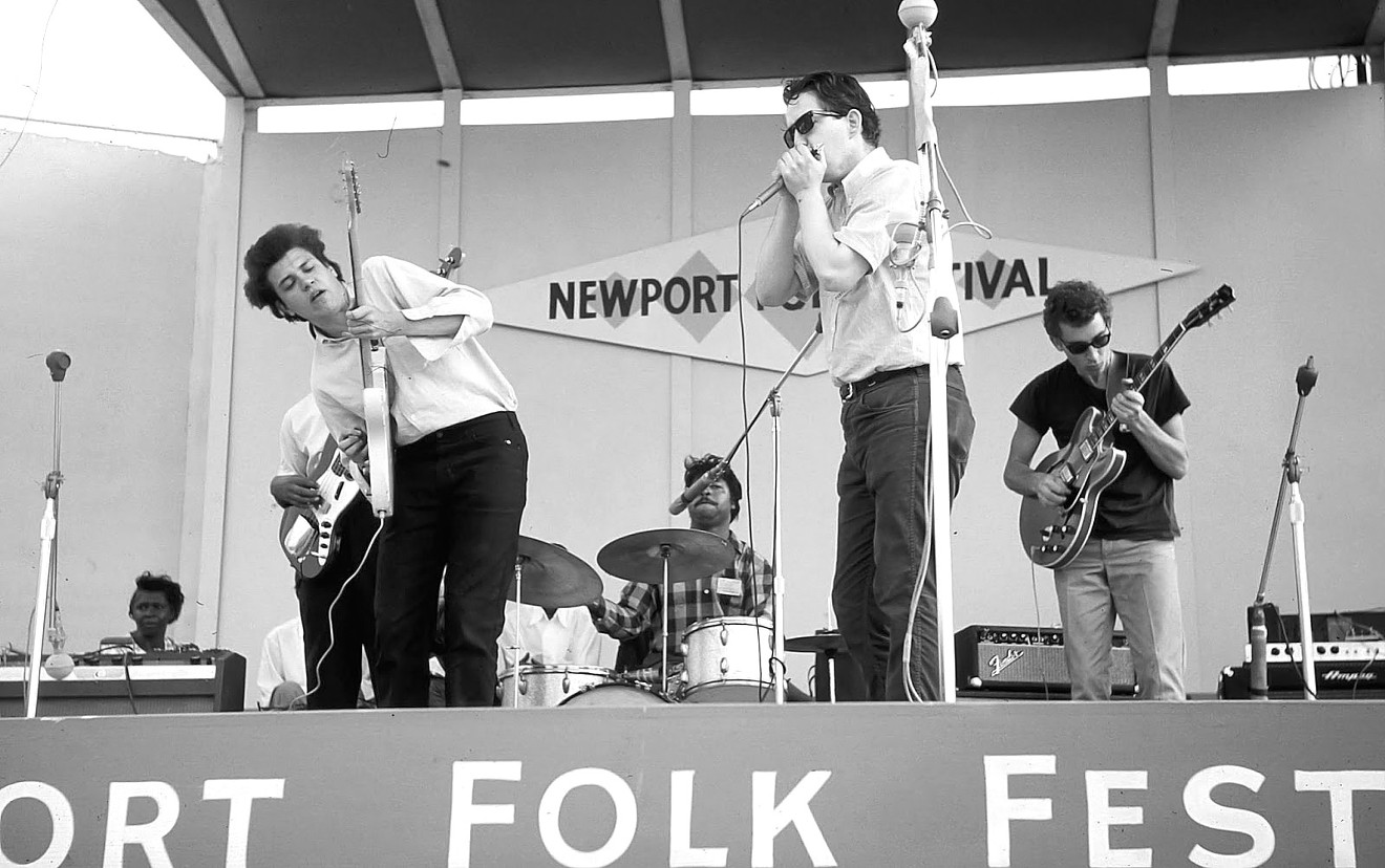 The Paul Butterfield Blues Band with guest guitarist Mike Bloomfield runs through a blues at their sound check prior to the New Folks concert at the Newport Folk Festival.