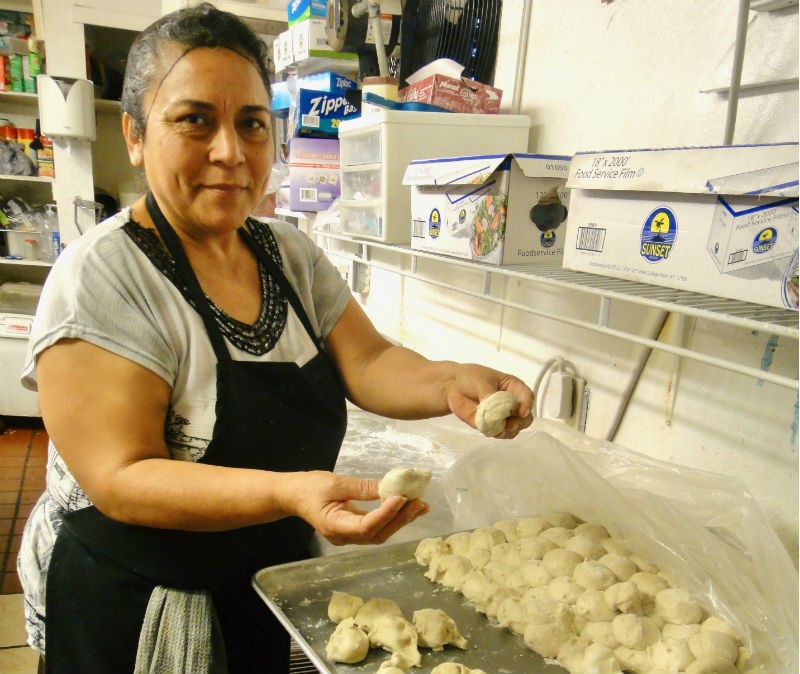 Griselda Delgado Ochoa prepares the dough balls for her fluffy flour tortillas that she’s been making at Doña María for ten years.