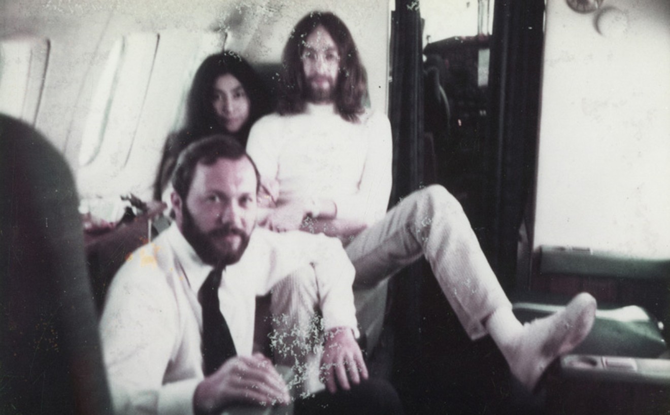 After John and Yoko’s wedding in Gibraltar, flying in a private jet to Paris. Peter Brown, Yoko Ono, and John Lennon. March 20, 1969.