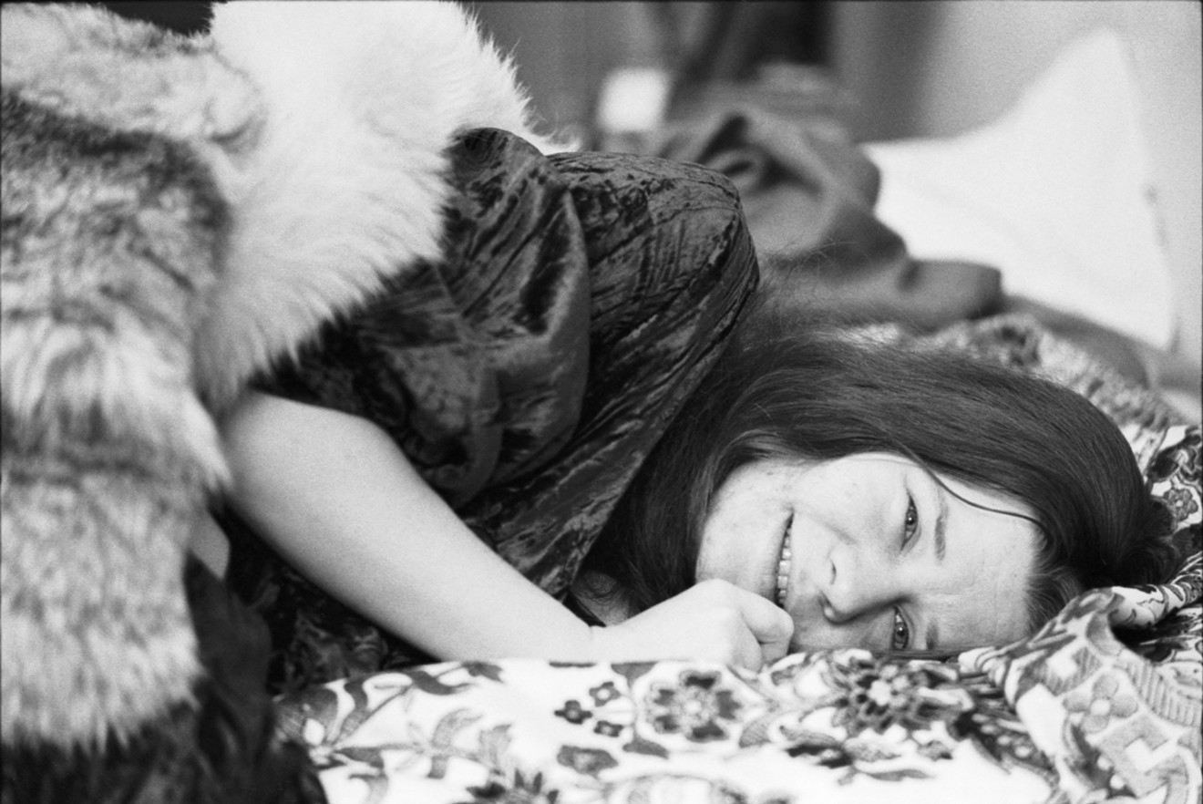 Janis Joplin lounging in her favorite room  at the Chelsea Hotel in New York City, 1969.