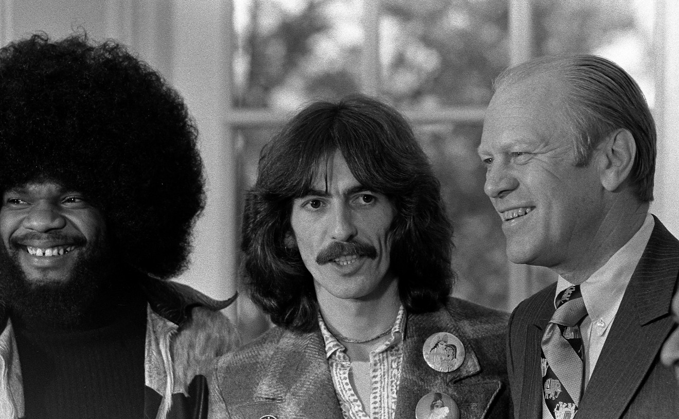 Musicians Billy Preston, George Harrison, and Ravi Shankar (right) visit President Gerald Ford in the Oval Office on December 13, 1974.