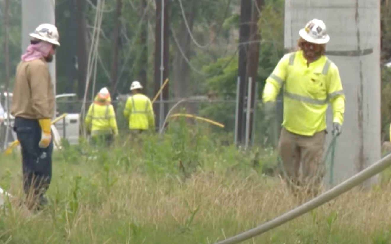 CenterPoint crew work on power lines affected by the derecho storm.