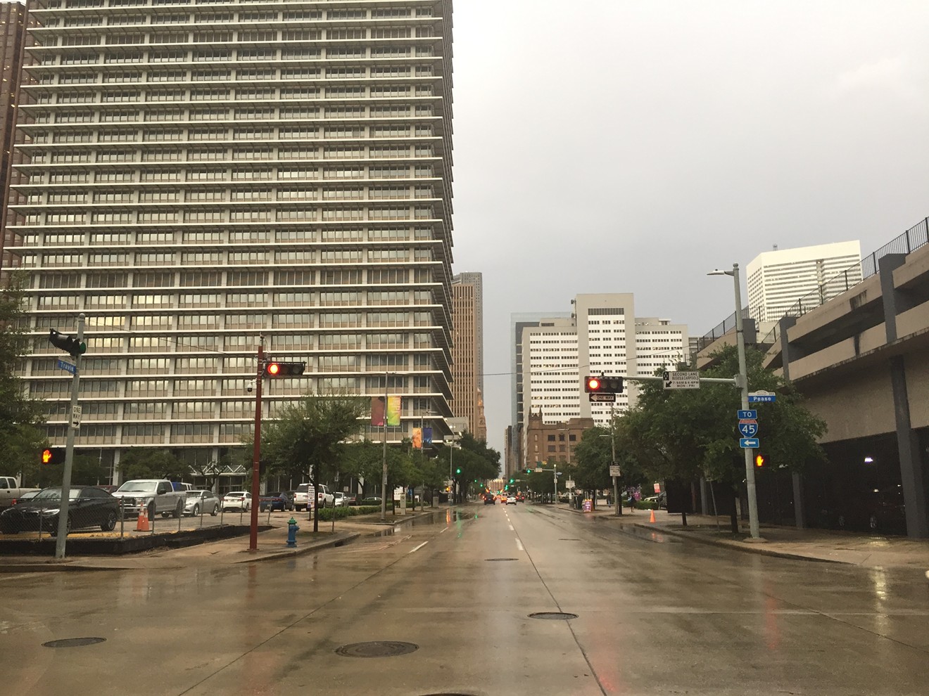 The rain-wet streets of downtown Houston on Monday.