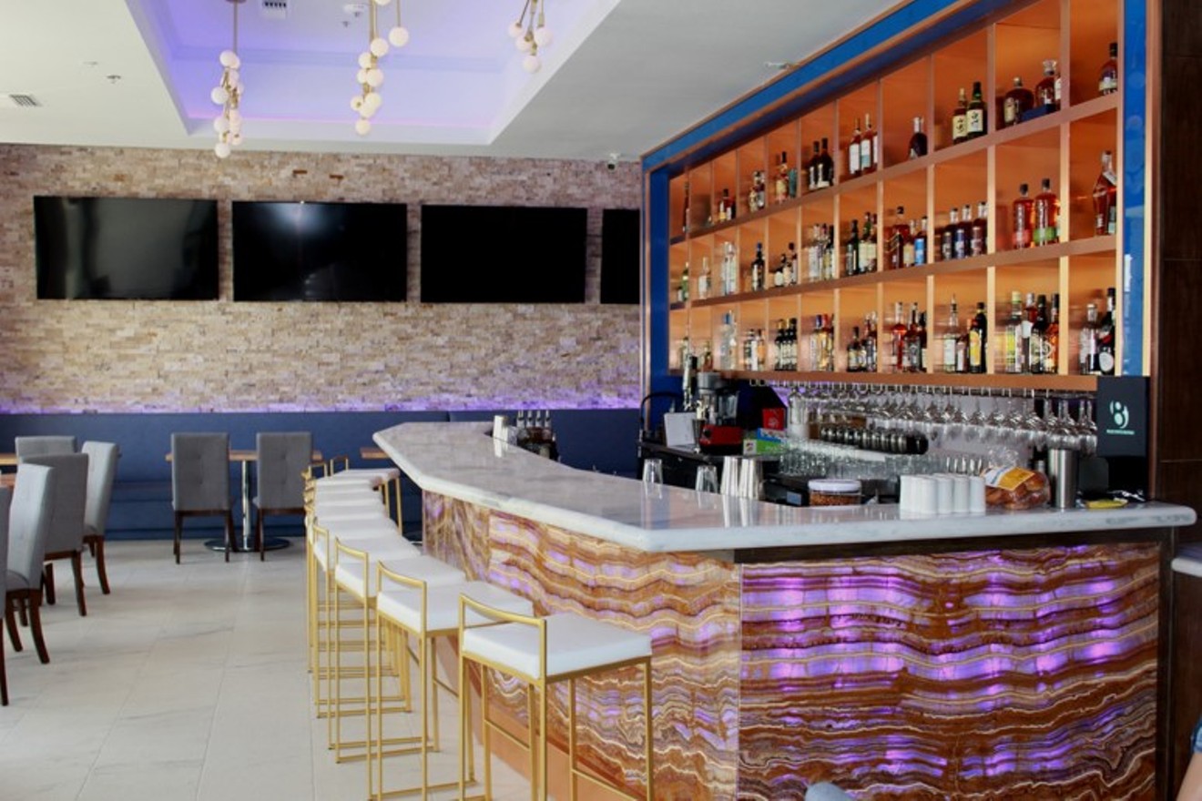 The bar at Blue Onyx Bistro is stylishly dramatic.