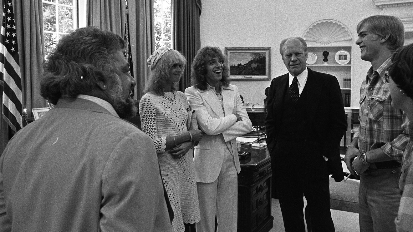 Peter Frampton was such a huge rock star in 1976 that he got invited to the White House. L to R: Manager Dee Anthony, girlfriend Penny McCall, Frampton, President Gerald Ford, and first son Steven Ford.