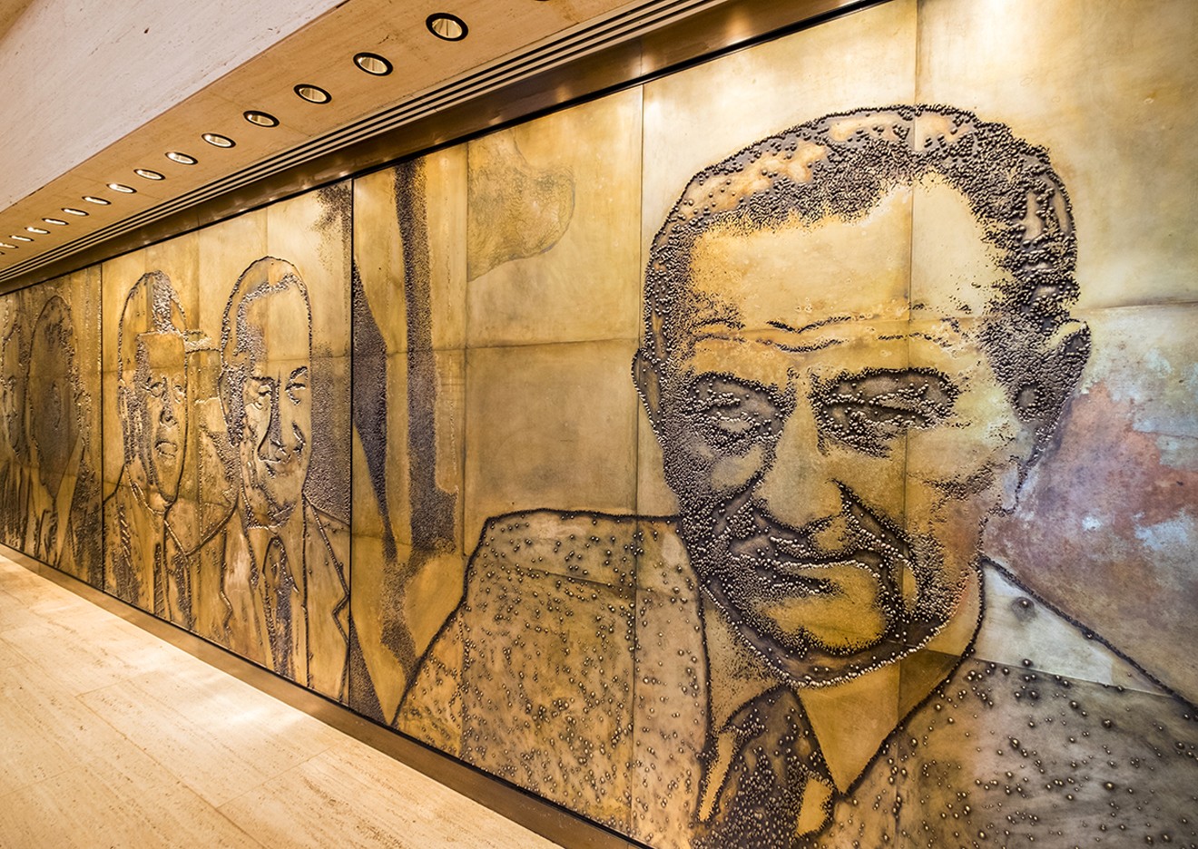 It takes an ego as big as Texas to sit in the White House. A centerpiece in the Great Hall of the LBJ Library is the photo-engraving mural by artist Naomi Savage. Each etched magnesium plate measures eight feet by ten feet.