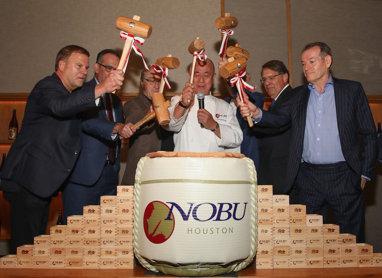 Nobu Founders Robert De Niro, Chef Nobu Matsuhisa, Meir Teper, and friends break open a 5-gallon sake barrel at the Nobu Houston Sake Ceremony.