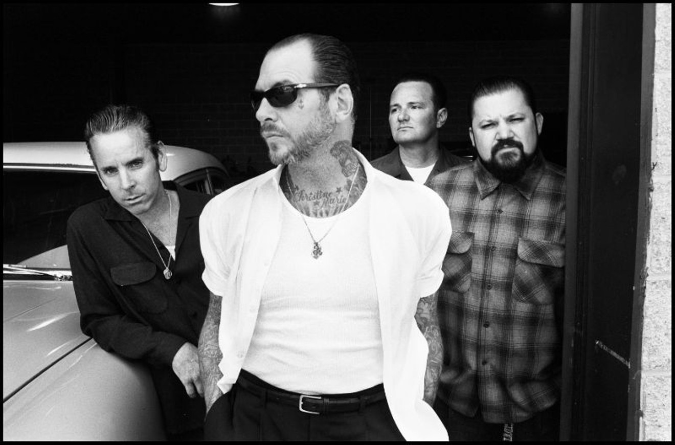 Mike Ness, foreground, and Social Distortion
