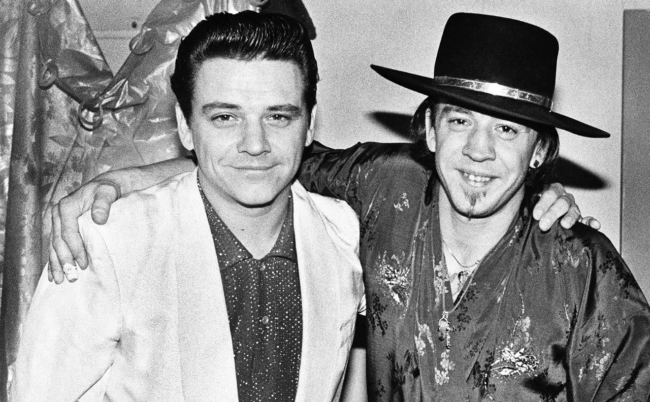 Stevie Ray Vaughan (right) with his older brother and guitar hero Jimmie, backstage at the Austin Opry House, 1984