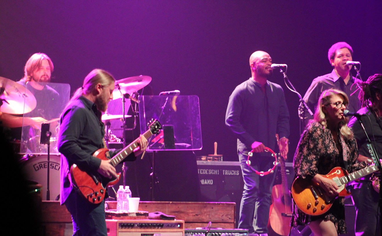 Drummer Tyler Greenwell and vocalists Mark Rivers and Mike Mattison (back) with lead guitarist Derek Trucks and lead singer/guitarist Susan Tedeschi (front)