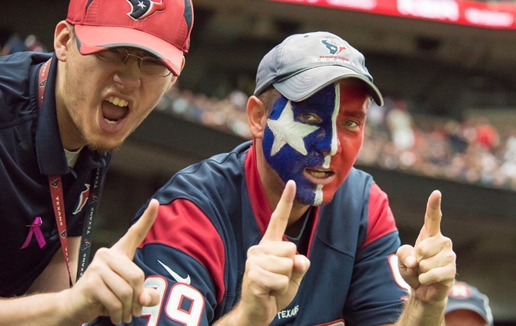 Texans fans like these guys will be allowed back in NRG Stadium for home games starting Sunday, but they'll have to bring their face masks.