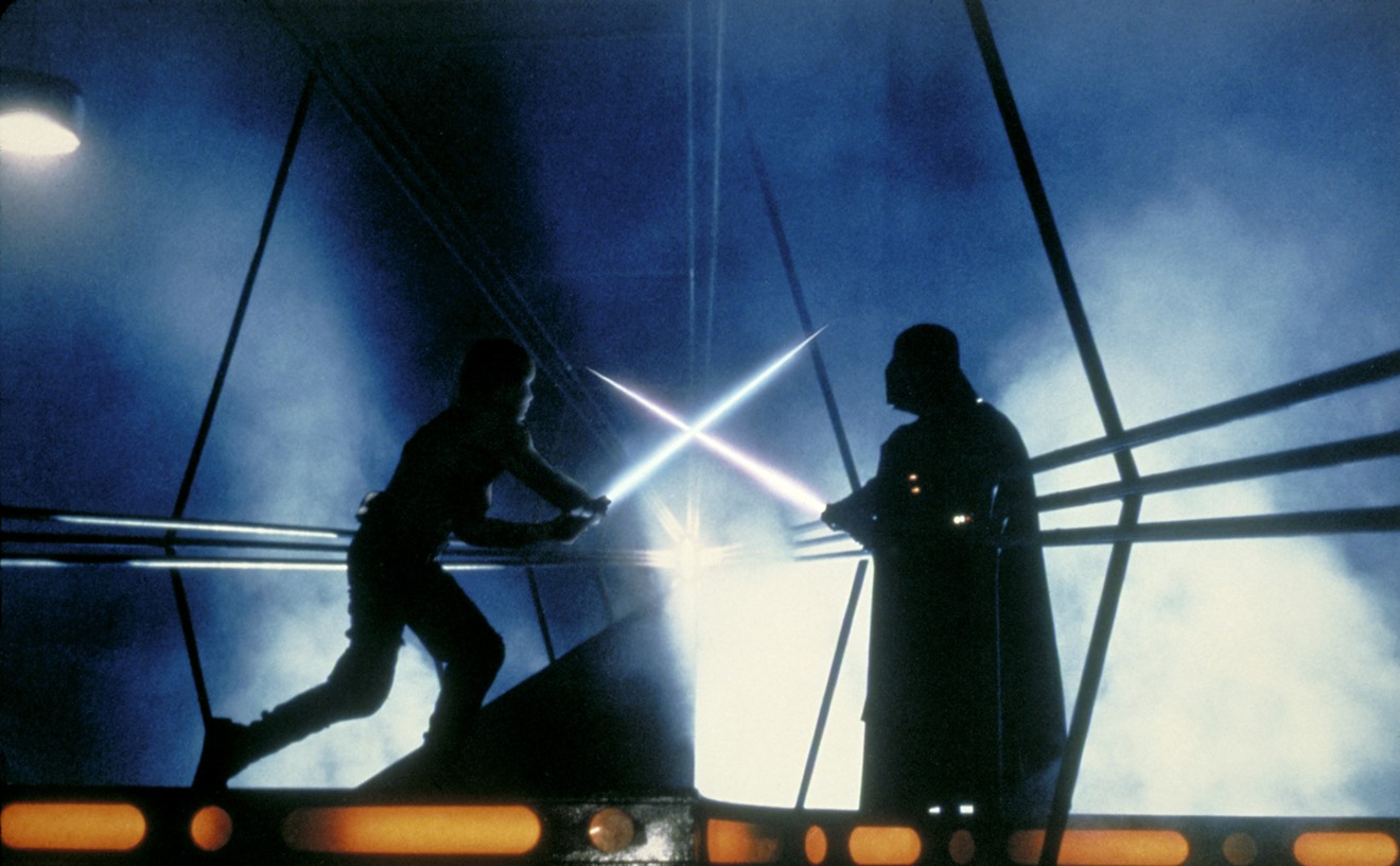 Two iconic film characters battle it out on the screen during a screening of Star Wars: The Empire Strikes Back.