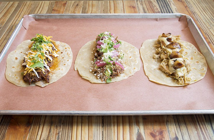 Each member of the trio of tacos — brisket, pulled pork and chicken — stands up on its own right.
