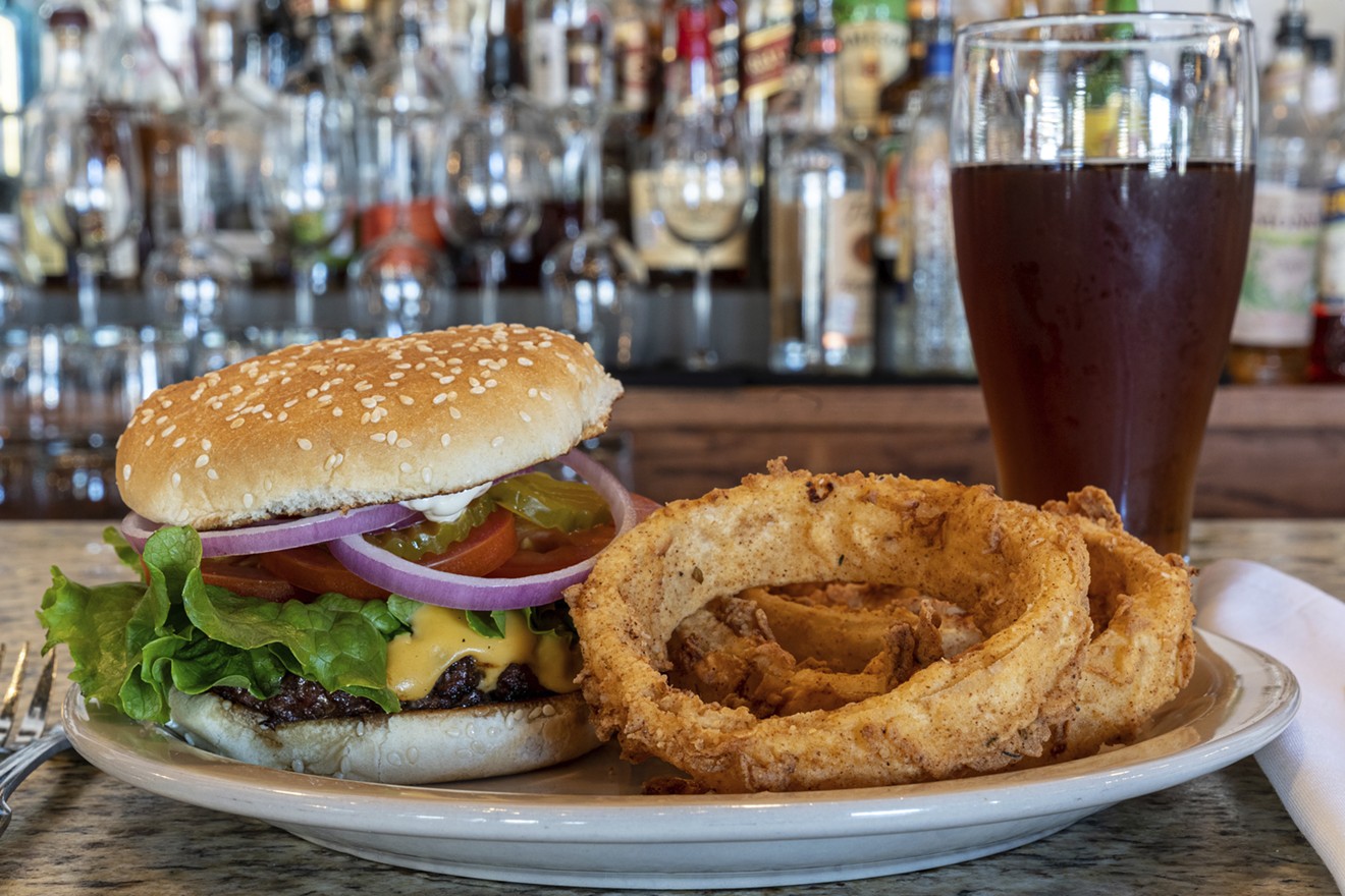 Eugene's Burger cozies up to some onion rings.