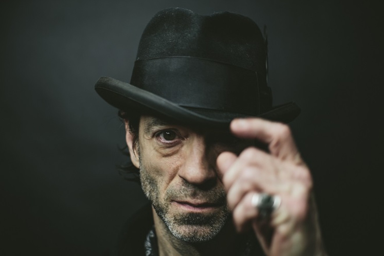 Travis Meadows plays Main Street Crossing in Tomball on Monday night.