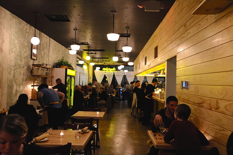 The main dining room at Nancy's Hustle has this retro-warehouse feel. - PHOTO BY MAI PHAM