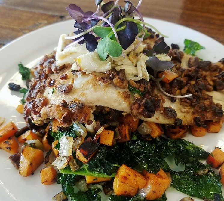One of the specials: pecan crusted flounder over sweet potatoes and crispy kale, topped with crab meat and purple radish micro greens. - PHOTO COURTESY OF SOUTHERN BOI CAFE